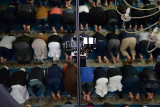 Detail of automated filming device during congregational prayer at Brick Lane Mosque. 