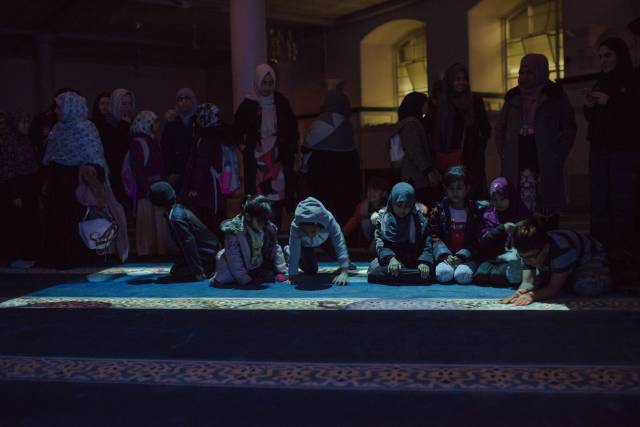 Documentation of site performance for local school children in main prayer hall at Brick Lane Mosque