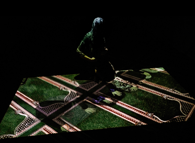 Female congregation member interacting with projected image